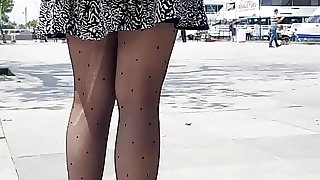 Sexy girl in ripped patterned  black pantyhose